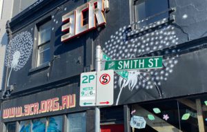 A street sign for Smith Street outside the front of the 3CR radio station