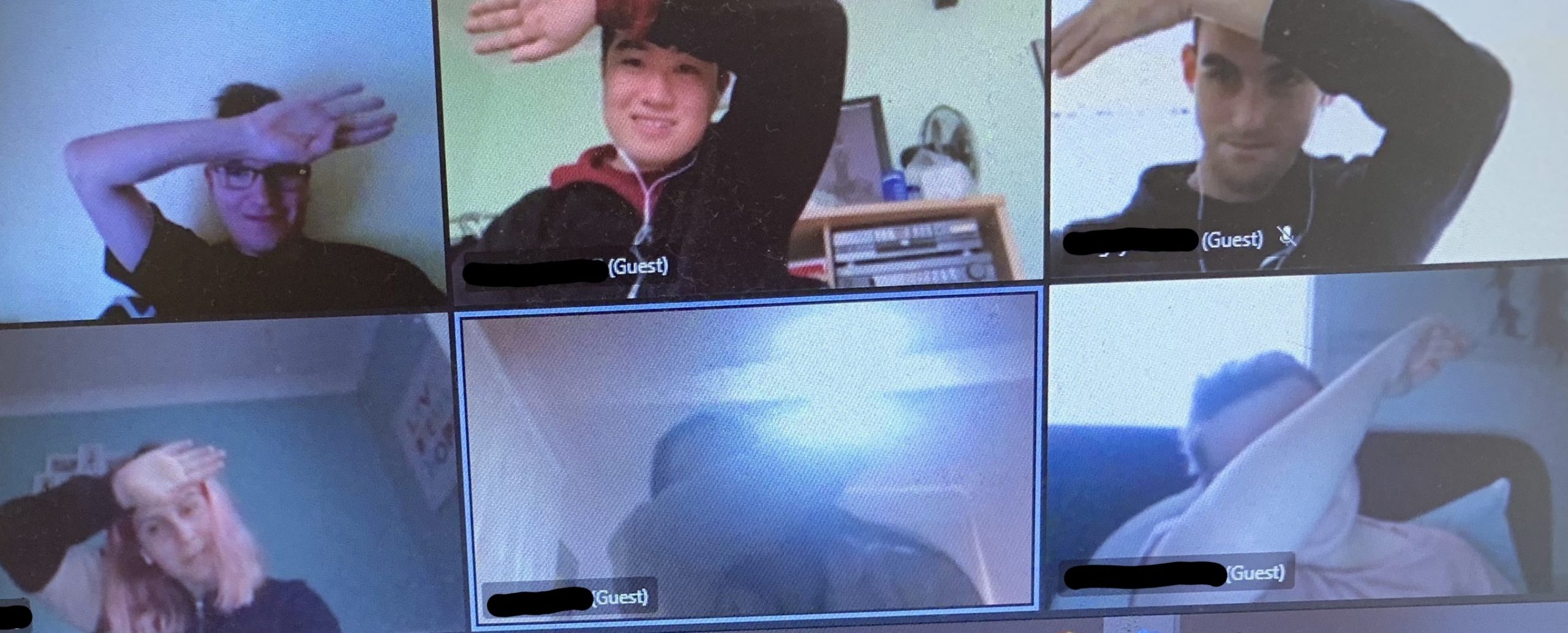 A screenshot of six people on an online conference call, they are all raising their arms to do the dab