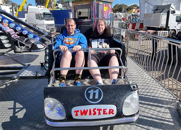 Scott and Alice are strapped into a ride car