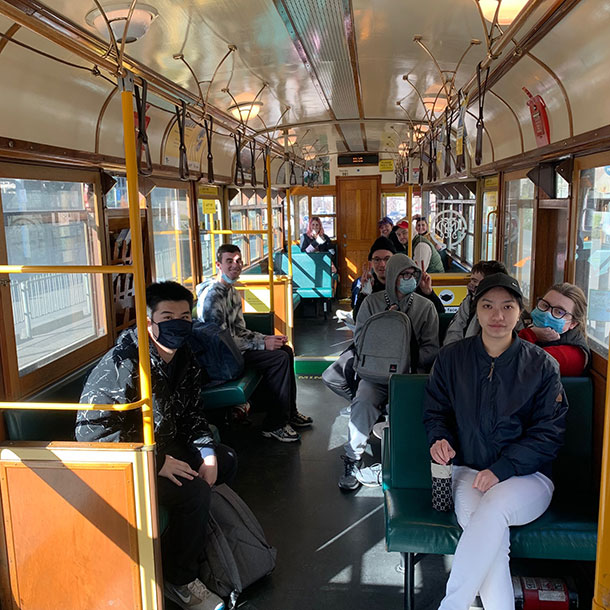 People sit inside the old fashioned city-circle tram